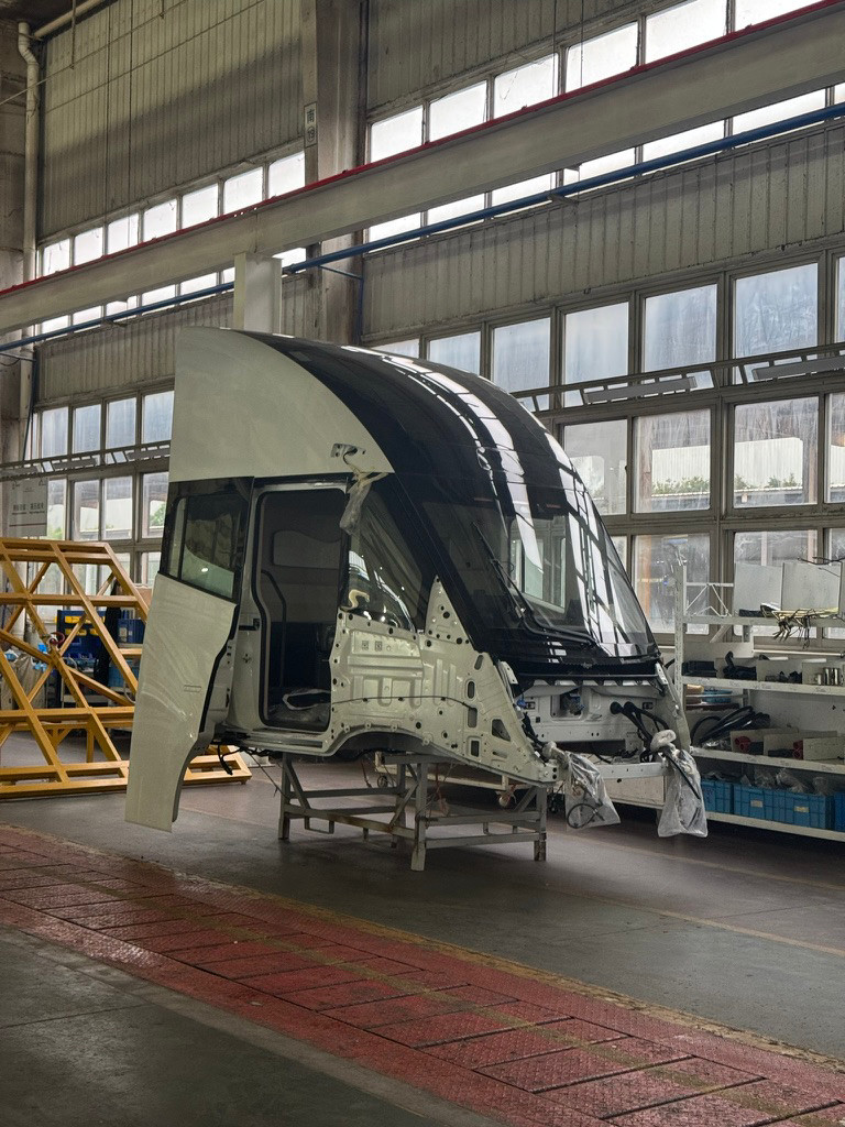 Windrose cab assembly on a transport stand in the cab shop